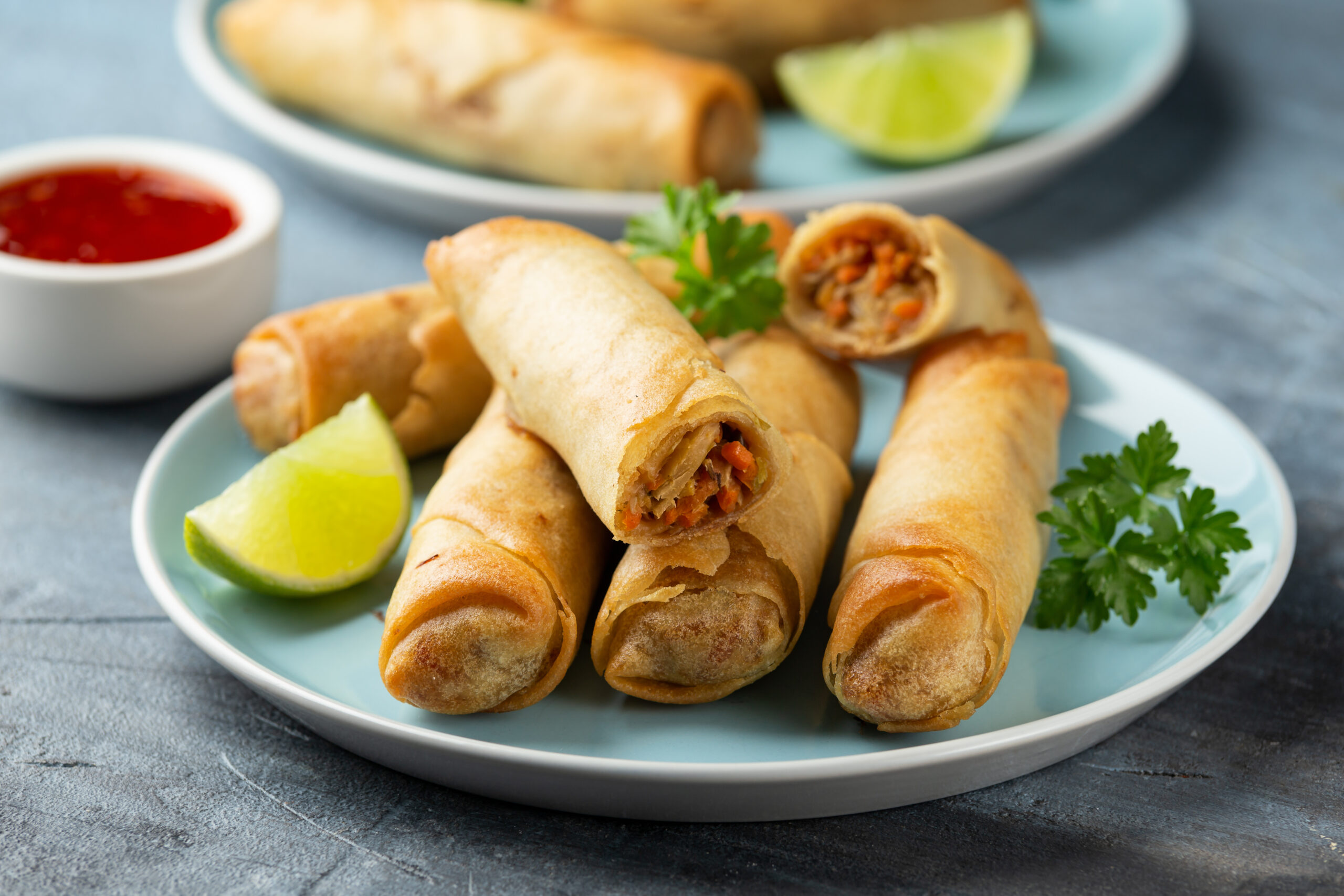 Fried,Spring,Rolls,With,Sweet,Chili,Sauce,And,Lime,On